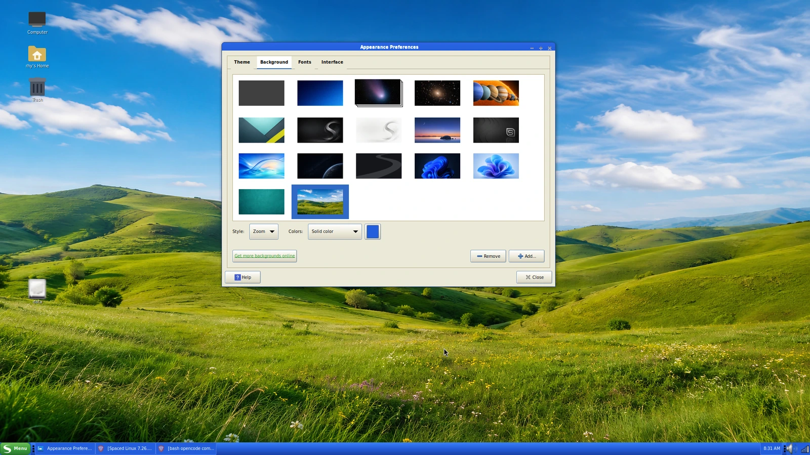Spaced Linux Windows XP theme with a blue taskbar, green menu button, and rolling-hills wallpaper